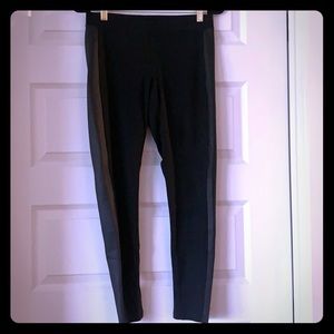 Black stretch pants with faux leather detail